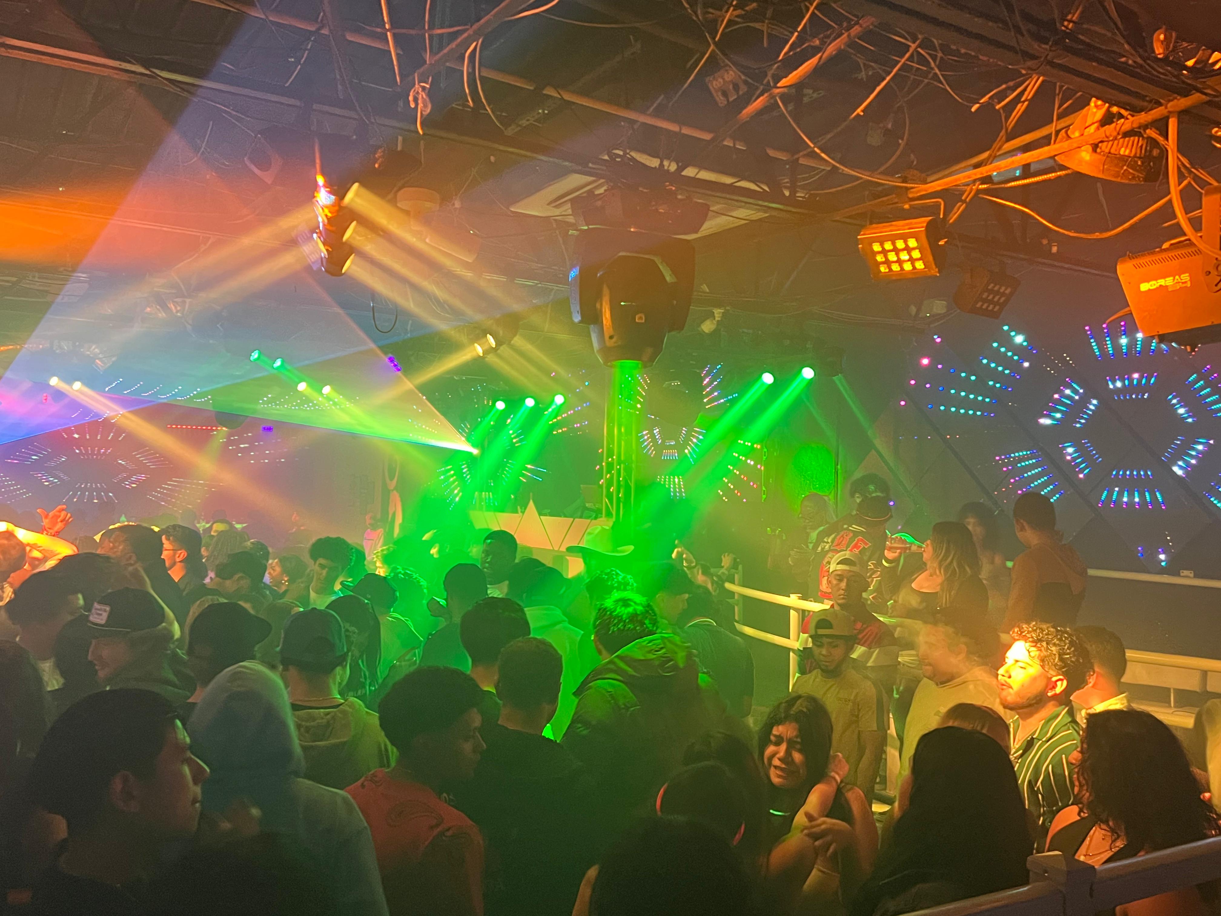 Nightclub crowd with lights and lasers